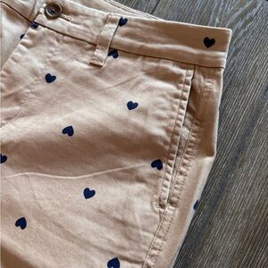 Khaki with navy blue hearts. Straight leg